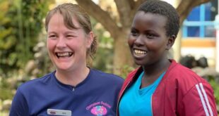 The Kenyan women being helped by Alnwick stoma swimmer